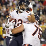 Chicago Bears' Matt Forte (22) celebrates his touchdown run with teammate Kyle Long (75) during the first half of an NFL football game against the Green Bay Packers Monday, Nov. 4, 2013, in Green Bay, Wis. (AP Photo/Mike Roemer)