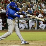 Chicago Cubs' Junior Lake connects for an RBI single in the ninth inning of a baseball game against the Arizona Diamondbacks on Monday, July 22, 2013, in Phoenix. The Cubs defeated the Diamondbacks 4-2. (AP Photo/Ross D. Franklin)