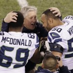 Seattle Seahawks head coach Pete Carroll embraces Clinton McDonald manx K.J. Wright after the second half of the NFL Super Bowl XLVIII football game against the Denver Broncos, Sunday, Feb. 2, 2014, in East Rutherford, N.J. The Seahawks won 43-8. (AP Photo/Charlie Riedel)