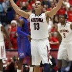 Arizona's Nick Johnson (13) rallys the crowd against Florida during the second half of an NCAA college basketball game at McKale Center in Tucson, Ariz., Saturday, Dec. 15, 2012. Arizona won 65 - 64. (AP Photo/Wily Low)