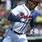 Atlanta Braves' B.J. Upton reacts, while rounding first base, after hitting a two-run home run during the fourth inning of an exhibition spring training baseball game against the Detroit Tigers in Kissimmee, Fla., Sunday, March 3, 2013.(AP Photo/Phelan M. Ebenhack)