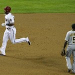 Arizona Diamondbacks' Chris Young, left, rounds the bases after hitting a home run as Pittsburgh Pirates' Josh Harrison (5) looks away during the sixth inning in an MLB baseball game Monday, April 16, 2012, in Phoenix.(AP Photo/Ross D. Franklin)