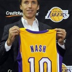 Newly-acquired Los Angeles Lakers guard Steve 
Nash holds up his new jersey during a news 
conference at the team's headquarters in El 
Segundo, Calif., Wednesday, July 11, 2012. 
The Lakers acquired two-time MVP Nash from 
the Phoenix Suns in exchange for first round 
draft picks in 2013 and 2015 as well as 
second round draft picks in 2013 and 2014. 
(AP Photo/Reed Saxon)