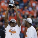  Denver Broncos wide receiver Demaryius Thomas, left, holds up the trophy after the AFC Championship NFL playoff football game against the New England Patriots in Denver, Sunday, Jan. 19, 2014. The Broncos defeated the Patriots 26-16 to advance to the Super Bowl. (AP Photo/Julie Jacobson)