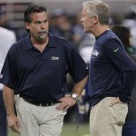 St. Louis Rams head coach Jeff Fisher and Seattle Seahawks head coach Pete Carroll talk before an NFL football game, Monday, Oct. 28, 2013, in St. Louis. (AP Photo/Tom Gannam)
