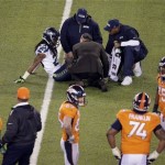 Seattle Seahawks' Richard Sherman is attended to by medical staff due to injury against the Denver Broncos during the second half of the NFL Super Bowl XLVIII football game Sunday, Feb. 2, 2014, in East Rutherford, N.J. (AP Photo/Charlie Riedel)