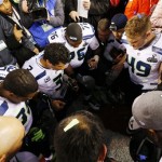 Members of the Seattle Seahawks pray after the NFL Super Bowl XLVIII football game against the Denver Broncos Sunday, Feb. 2, 2014, in East Rutherford, N.J. The Seahawks won 43-8. (AP Photo/Paul Sancya)