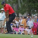 Tiger Woods reacts to a missed birdie putt on the third hole during the final round of The Players championship golf tournament at TPC Sawgrass, Sunday, May 12, 2013, in Ponte Vedra Beach, Fla. (AP Photo/John Raoux)