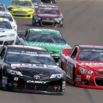  Ryan Truex (83) and Justin Allgaier (51) lead a group of drivers into Turn 1 during the NASCAR Sprint Cup Series auto race Sunday, March 2, 2014, in Avondale, Ariz. (AP Photo/Ross D. Franklin)