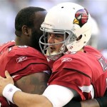 Arizona Cardinals' Kevin Kolb, right gets a hug from teammate Jeremy Bridges prior to an NFL football game against the Dallas Cowboys, Sunday, Dec. 4, 2011, in Glendale, Ariz. (AP Photo/Ross D. Franklin)