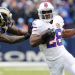 Buffalo Bills running back C.J. Spiller (28) rushes with the ball as St. Louis Rams free safety Quintin Mikell (27) pushes him out of bounds during the first half of an NFL football game, Sunday, Dec. 9, 2012, in Orchard Park, N.Y. (AP Photo/Bill Wippert)

