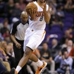 Phoenix Suns' Channing Frye tries to save a loose ball during the first half of an NBA basketball game against the Memphis Grizzlies, Thursday, Jan. 2, 2014, in Phoenix. (AP Photo/Matt York)