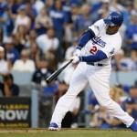 Los Angeles Dodgers' Carl Crawford hits a three-run home run against the Atlanta Braves in the second inning of Game 3 of the National League division baseball series Sunday, Oct. 6, 2013, in Los Angeles. (AP Photo/Danny Moloshok)