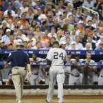 American League's Robinson Cano, of the New York Yankees, walks off the field after getting hit on the knee by pitch from National League's Matt Harvey, of the New York Mets, during the first inning of the MLB All-Star baseball game, on Tuesday, July 16, 2013, in New York. (AP Photo/Matt Slocum)