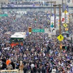 Baltimore Ravens fans fill the streets during a victory parade Tuesday, Feb. 5, 2013, in Baltimore. The Ravens defeated the San Francisco 49ers in NFL football's Super Bowl XLVII 34-31 on Sunday.(AP Photo/Steve Ruark)
