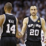 San Antonio Spurs shooting guard Manu Ginobili (20) and San Antonio Spurs point guard Gary Neal (14) react after second half of Game 1 of the NBA Finals basketball game against the Miami Heat, Thursday, June 6, 2013 in Miami. (AP Photo/Lynne Sladky)
