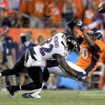 Baltimore Ravens strong safety James Ihedigbo (32) breaks up a pass intended for Denver Broncos tight end Julius Thomas (80) during the first half of an NFL football game, Thursday, Sept. 5, 2013, in Denver. (AP Photo/Jack Dempsey)