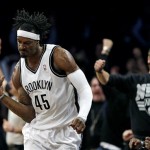 Brooklyn Nets' Gerald Wallace celebrates after sinking a 3-point shot against the Chicago Bulls during the second half in Game 7 of their first-round NBA basketball playoff series in New York, Saturday, May 4, 2013. (AP Photo/Julio Cortez)