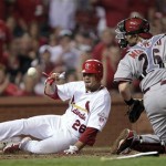 St. Louis Cardinals' Kyle Lohse (26) scores from second on a single by Allen Craig as Arizona Diamondbacks catcher Miguel Montero misplays the throw in the fifth inning of a baseball game Thursday, Aug. 16, 2012, in St. Louis. (AP Photo/Tom Gannam)