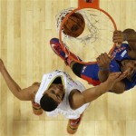 Team Hill's Andre Drummond of the Detroit Pistons (0) dunks the ball against Team Webber's Anthony Davis of the New Orleans Pelicans during the Rising Star NBA All Star Challenge Basketball game, Friday, Feb. 14, 2014, in New Orleans. (AP Photo/Gerald Herbert)
