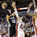 San Antonio Spurs center Tiago Splitter (22) heads to the hoop under pressure from the Miami Heat's Chris Andersen (11) Mike Miller (13) as LeBron James (6) looks on during the first half of Game 2 of the NBA Finals basketball game, Sunday, June 9, 2013 in Miami. (AP Photo/Lynne Sladky)