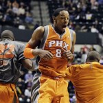 Phoenix Suns' Channing Frye (8) reacts with Michael Redd and Sebastian Telfair during the second half of an NBA basketball game against the Indiana Pacers, Friday, March 23, 2012, in Indianapolis. Phoenix won 113-111. (AP Photo/Darron Cummings)
