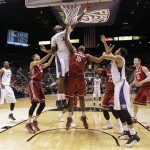 Washington's Jernard Jarreau (33) tips the ball in over Washington State's Junior Longrus (15) in the first half during a Pac-12 tournament NCAA college basketball game, Wednesday, March 13, 2013, in Las Vegas. (AP Photo/Julie Jacobson)