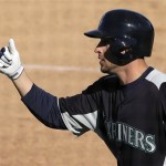 Seattle Mariners' Alex Liddi celebrates after hitting a two-run home during an exhibition spring training baseball game against the Los Angeles Angels, Monday, Feb. 25, 2013, in Peoria, Ariz. (AP Photo/Charlie Riedel)