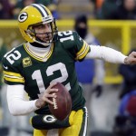  Green Bay Packers quarterback Aaron Rodgers (12) scrambles during the first half of an NFL wild-card playoff football game against the San Francisco 49ers, Sunday, Jan. 5, 2014, in Green Bay, Wis. (AP Photo/Mike Roemer)