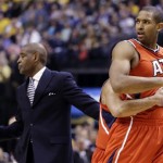 Atlanta Hawks center Al Horford, right, is restrained by teammate Devin Harris after being called for a technical foul in the first half of Game 2 of a first-round NBA basketball playoff series against the Indiana Pacers in Indianapolis, Wednesday, April 24, 2013. (AP Photo/Michael Conroy)
