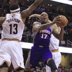 Phoenix Suns' P.J. Tucker (17) jumps to the basket between Cleveland Cavaliers' Tristan Thompson (13) and another defender during the second quarter of an NBA basketball game Tuesday, Nov. 27, 2012, in Cleveland. (AP Photo/Tony Dejak)