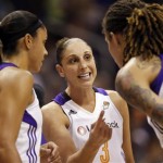 Phoenix Mercury's Diani Taurasi, center, talks with teammates Brittney Griner, right, and Candice Dupree during the first half of a WNBA basketball game against the San Antonio Silver Stars, Friday, Sept. 13, 2013, in Phoenix. (AP Photo/Matt York)
