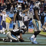 Carolina Panthers' Robert Lester, center, intercepts a New England Patriots pass on the final play of an NFL football game in Charlotte, N.C., Monday, Nov. 18, 2013. The Panthers won 24-20. (AP Photo/Chuck Burton)