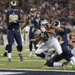 Seattle Seahawks wide receiver Golden Tate (81) rolls in to the end zone for a touchdown after making a reception against St. Louis Rams cornerback Trumaine Johnson (22) during the first half of an NFL football game, Monday, Oct. 28, 2013, in St. Louis. (AP Photo/Michael Conroy)