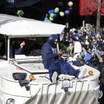 Seattle Seahawks running back Marshawn Lynch rides on the hood of a vehicle during the parade for the NFL football Super Bowl champions, Wednesday, Feb. 5, 2014, in Seattle. The Seahawks defeated the Denver Broncos 43-8 on Sunday. (AP Photo/Ted S. Warren)
