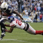 San Diego Chargers wide receiver Eddie Royal, left, gets past New York Giants strong safety Antrel Rolle, right, in the second half of an NFL football game on Sunday, Dec. 8, 2013, in San Diego. (AP Photo/Gregory Bull)