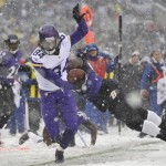 Minnesota Vikings wide receiver Cordarrelle Patterson (84) tries to stay in bounds as he rushes the ball past Baltimore Ravens linebacker Pernell McPhee in the first half of an NFL football game on Sunday, Dec. 8, 2013, in Baltimore. (AP Photo/Gail Burton)