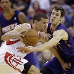  Phoenix Suns' Goran Dragic tries to knock the ball away from Houston Rockets' Francisco Garcia, left, during the second quarter of an NBA basketball game Wednesday, Dec. 4, 2013, in Houston. (AP Photo/David J. Phillip)