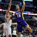Los Angeles Lakers' Pau Gasol (16), of Spain, goes up for a shot against Chicago Bulls' Joakim Noah (13), during the third quarter of an NBA basketball game in Chicago, Monday, Jan. 20, 2014. Chicago won 102-100, in overtime. (AP Photo/Paul Beaty)