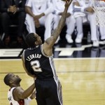 San Antonio Spurs small forward Kawhi Leonard (2) shoots against Miami Heat shooting guard Dwyane Wade (3) during the first half of Game 6 of the NBA Finals basketball series, Tuesday, June 18, 2013 in Miami. (AP Photo/Wilfredo Lee)