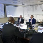 This photo provided by the Denver Broncos shows head coach John Fox, back left, and vice president John Elway, center facing camera, in the "War Room" at the NFL football team's headquarters in Englewood, Colo., on Thursday, April 25, 2013. The Broncos are scheduled to pick 28th in the first round. (AP Photo/Denver Broncos, Eric Bakke)