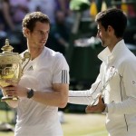 Winner Andy Murray of Britain, left, and Novak Djokovic of Serbia pose with their trophies following the Men's singles final match at the All England Lawn Tennis Championships in Wimbledon, London, Sunday, July 7, 2013. (AP Photo/Alastair Grant)
