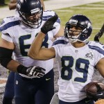 Seattle Seahawks wide receiver Doug Baldwin (89) celebrates with tackle Breno Giacomini (68) after scoring a touchdown against the Denver Broncos during the second half of the NFL Super Bowl XLVIII football game, Sunday, Feb. 2, 2014, in East Rutherford, N.J. (AP Photo/Gregory Bull)