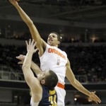 Syracuse guard Michael Carter-Williams (1) drives to the basket against California forward Robert Thurman (34) during the first half of a third-round game in the NCAA college basketball tournament Saturday, March 23, 2013, in San Jose, Calif. (AP Photo/Tony Avelar)
