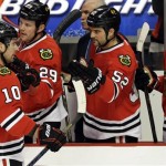  Chicago Blackhawks' Patrick Sharp (10) celebrates with teammates after scoring his goal during the first period of an NHL hockey game against the Phoenix Coyotes in Chicago, Thursday, Nov. 14, 2013. (AP Photo/Nam Y. Huh)