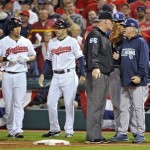 Tampa Bay Rays manager Joe Maddon, right, argues with first base umpire Ted Barrett after Cleveland Indians' Michael Brantley, left, was called safe at first on a close play in the fourth inning of the AL wild-card baseball game Wednesday, Oct. 2, 2013, in Cleveland. (AP Photo/Phil Long)