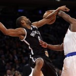 Brooklyn Nets' Alan Anderson, left, is fouled by New York Knicks' Raymond Felton during the second half of the NBA basketball game at Madison Square Garden, Monday, Jan. 20, 2014, in New York. The Nets defeated the Knicks 103-80. (AP Photo/Seth Wenig)