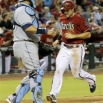 Arizona Diamondbacks' Eric Chavez scores on a Wil Nieves sacrifice fly as Tampa Bay Rays catcher Jose Molina watches during the fifth inning of a baseball game, Wednesday, Aug. 7, 2013, in Phoenix. (AP Photo/Matt York)