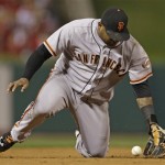 San Francisco Giants' Pablo Sandoval can't handle a ball hit by St. Louis Cardinals' Pete Kozma during the second inning of Game 4 of baseball's National League championship series Thursday, Oct. 18, 2012, in St. Louis. (AP Photo/Jeff Roberson)