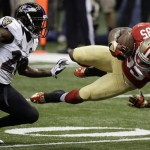 San Francisco 49ers tight end Vernon Davis (85) makes a catch against Baltimore Ravens safety Ed Reed (20) during the first half of the NFL Super Bowl XLVII football game, Sunday, Feb. 3, 2013, in New Orleans. (AP Photo/Gene Puskar)